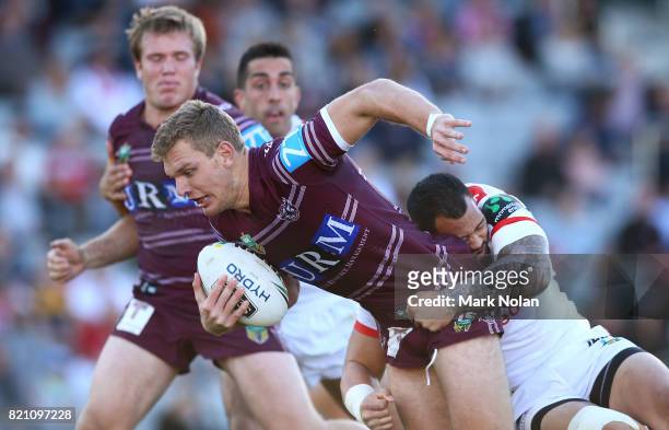 Tom Trbojevic of the Eagles is tackled during the round 20 NRL match between the St George Illawarra Dragons and the Manly Sea Eagles at WIN Stadium...
