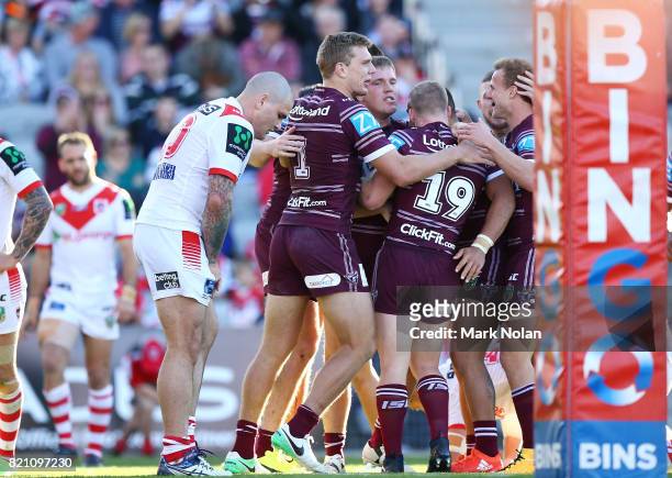 Jake Trbojevic of the Eagles celebrates scoring a try with team mates during the round 20 NRL match between the St George Illawarra Dragons and the...