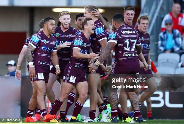 Eagles players celebrate a try by Akuila Uate during the round 20 NRL match between the St George Illawarra Dragons and the Manly Sea Eagles at WIN...