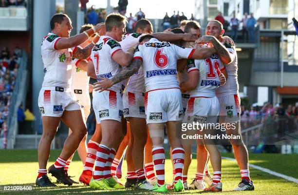 Dragons players celebrate a try by debutant Matthew Dufty during the round 20 NRL match between the St George Illawarra Dragons and the Manly Sea...