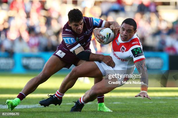 Tyson Frizell of the Dragons is tackled during the round 20 NRL match between the St George Illawarra Dragons and the Manly Sea Eagles at WIN Stadium...