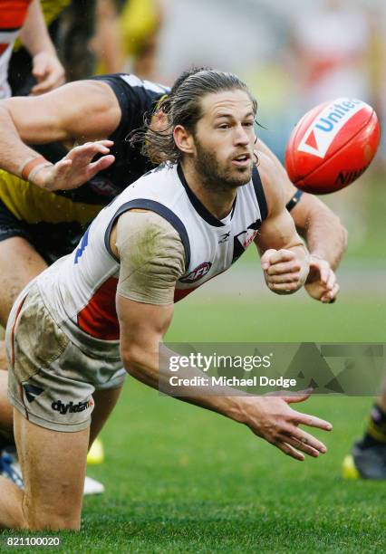 Callan Ward of the Giants handballs during the round 18 AFL match between the Richmond Tigers and the Greater Western Sydney Giants at Melbourne...