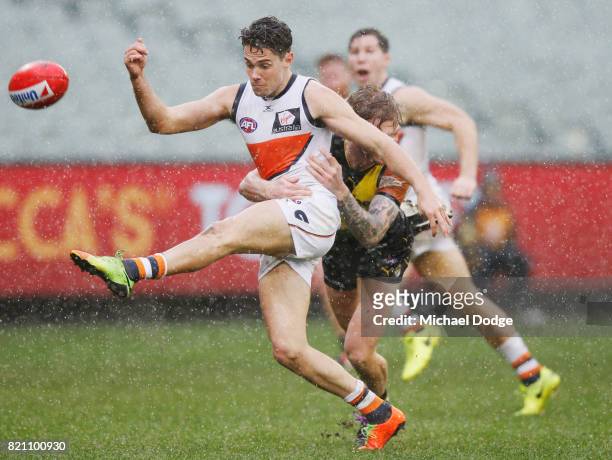 Josh Kelly of the Giants kicks the ball for a goal during the round 18 AFL match between the Richmond Tigers and the Greater Western Sydney Giants at...
