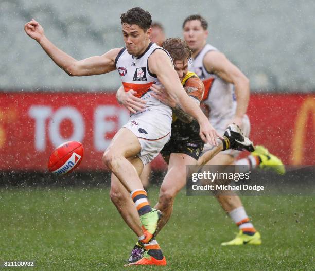 Josh Kelly of the Giants kicks the ball for a goal during the round 18 AFL match between the Richmond Tigers and the Greater Western Sydney Giants at...