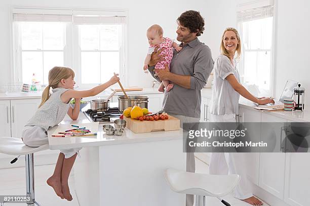 a family in a kitchen - kitchen cooking imagens e fotografias de stock