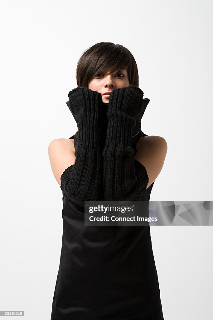 Young woman wearing black gloves