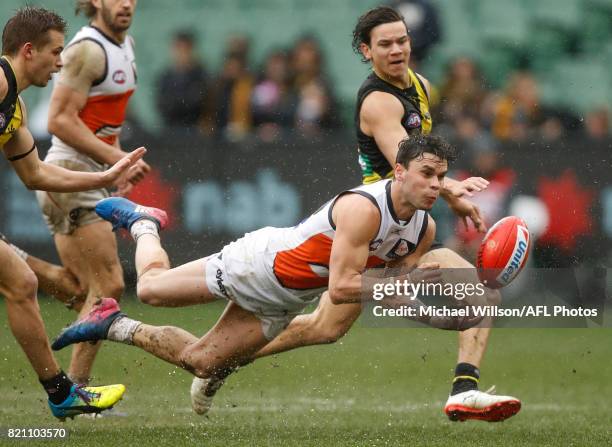 Zac Williams of the Giants handpasses the ball during the 2017 AFL round 18 match between the Richmond Tigers and the GWS Giants at the Melbourne...