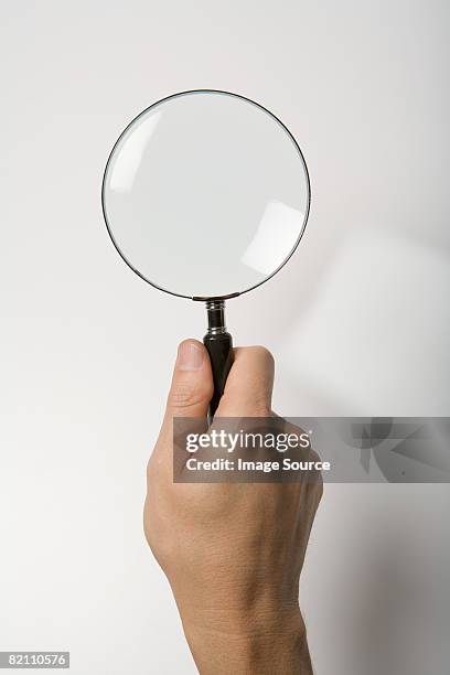 person with magnifying glass - lente d'ingrandimento foto e immagini stock