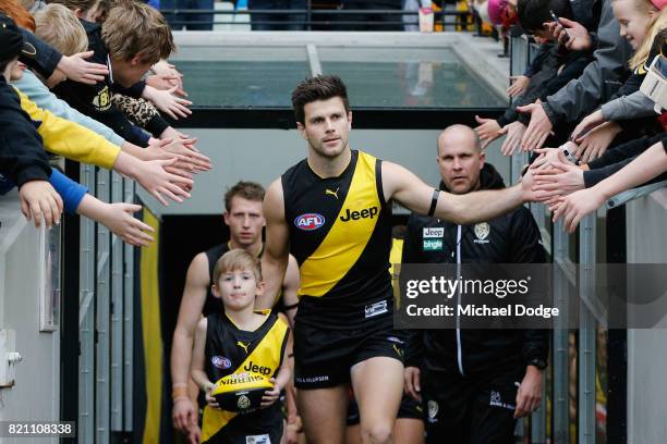 Trent Cotchin of the Tigers leads the team out during the round 18 AFL match between the Richmond Tigers and the Greater Western Sydney Giants at...