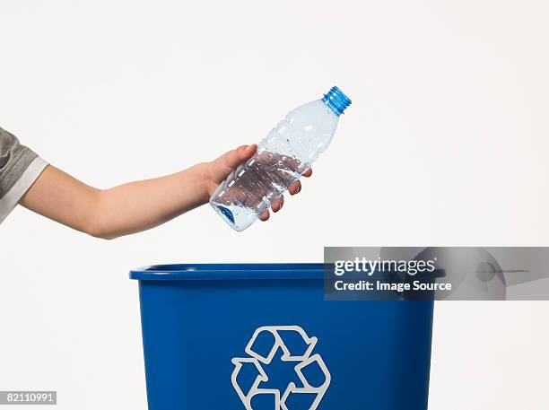 child recycling a bottle - plastic bottle stock pictures, royalty-free photos & images