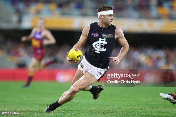 Sam Docherty of the Blues runs the ball during the round 18 AFL match between the Brisbane Lions and the Carlton Blues at The Gabba on July 23, 2017...