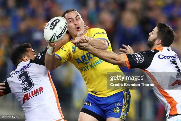 Brad Takairangi of the Eels passes the ball to a team mate during the round 20 NRL match between the Wests Tigers and the Parramatta Eels at ANZ...