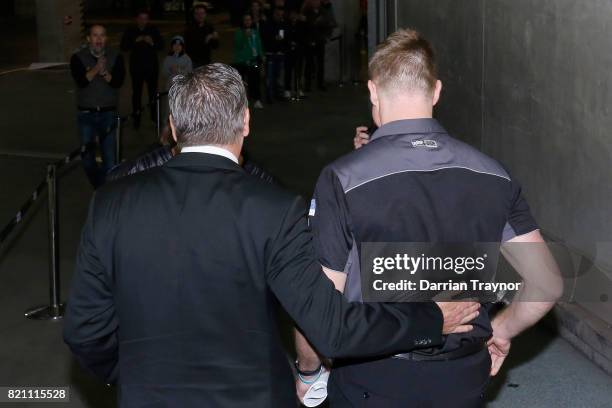 Collingwood President Eddie McGuire embraces Nathan Buckley, Senior Coach of the Magpies after the round 18 AFL match between the Collingwood Magpies...