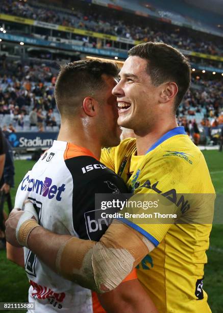 Mitchell Moses of the Eels hugs Luke Brooks of the Tigers following the round 20 NRL match between the Wests Tigers and the Parramatta Eels at ANZ...