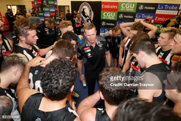 Nathan Buckley, Senior Coach of the Magpies adresses his player in the rooms after the round 18 AFL match between the Collingwood Magpies and the...