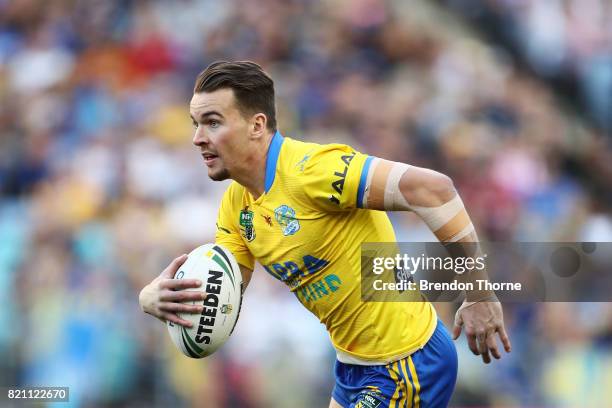 Clint Gutherson of the Eels runs the ball during the round 20 NRL match between the Wests Tigers and the Parramatta Eels at ANZ Stadium on July 23,...