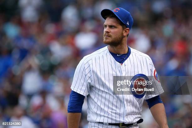 Justin Grimm of the Chicago Cubs walks off the field in the eighth inning against the St. Louis Cardinals at Wrigley Field on July 21, 2017 in...