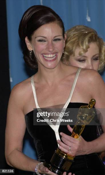 Best Actress Julia Roberts poses with her Oscar during the 73rd Annual Academy Awards March 25, 2001 at the Shrine Auditorium in Los Angeles. Roberts...