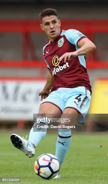 Ashley Westwood of Burnley passes the ball during the pre season friendly match between Kidderminster Harriers and Burnley at Aggborough Stadium on...