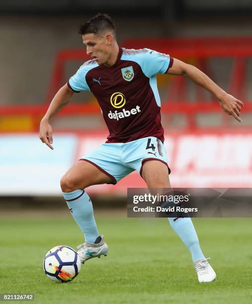 Ashley Westwood of Burnley runs with the ball during the pre season friendly match between Kidderminster Harriers and Burnley at Aggborough Stadium...