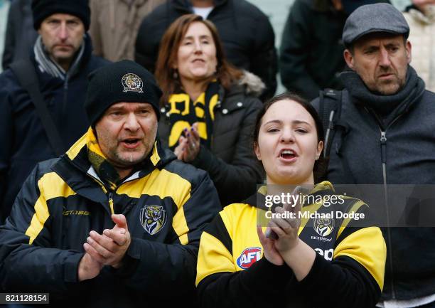 Tigers fans show their support during the round 18 AFL match between the Richmond Tigers and the Greater Western Sydney Giants at Melbourne Cricket...