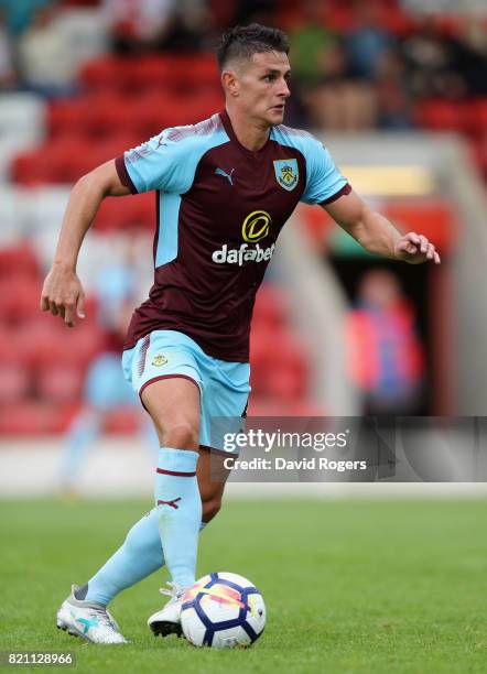 Ashley Westwood of Burnley runs with the ball during the pre season friendly match between Kidderminster Harriers and Burnley at Aggborough Stadium...