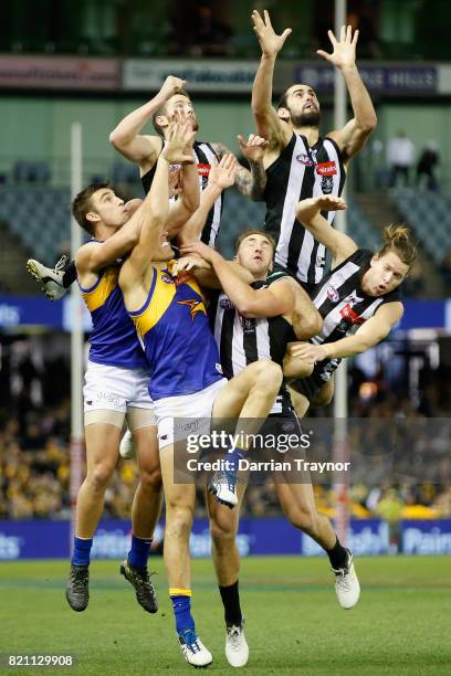 Brodie Grundy of the Magpies leaps for the ball during the round 18 AFL match between the Collingwood Magpies and the West Coast Eagles at Etihad...