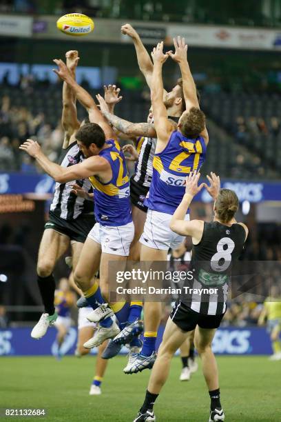 Jeremy Howe of the Magpies spoils the ball during the round 18 AFL match between the Collingwood Magpies and the West Coast Eagles at Etihad Stadium...