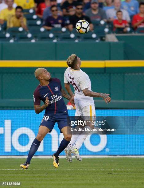 Juan Iturbe of AS Roma heads the ball away from Layvin Kurzawa of Paris Saint-Germain during the first half at Comerica Park on July 19, 2017 in...