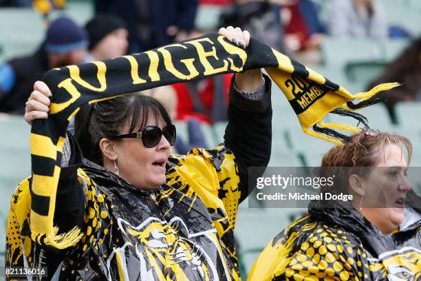 Tigers fans show their support during the round 18 AFL match between the Richmond Tigers and the Greater Western Sydney Giants at Melbourne Cricket...