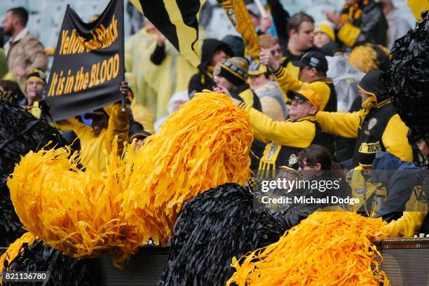 Tigers fans show their support during the round 18 AFL match between the Richmond Tigers and the Greater Western Sydney Giants at Melbourne Cricket...