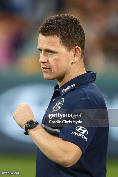 Blues coach Brendon Bolton talks to players during the round 18 AFL match between the Brisbane Lions and the Carlton Blues at The Gabba on July 23,...