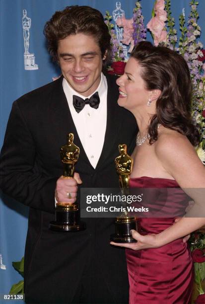 Best Supporting Actor Benicio Del Toro and Best Supporting Actress Marcia Gay Harden poses with their Oscars during the 73rd Annual Academy Awards...