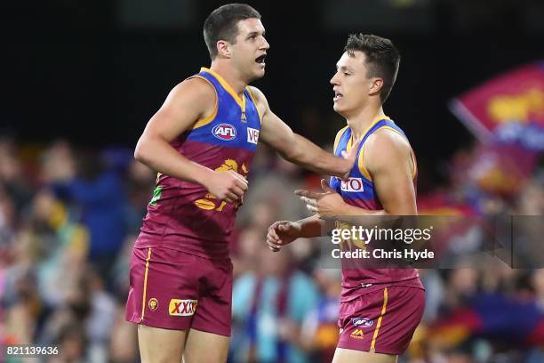 Jake Barrett of the Lions celebrates a goal during the round 18 AFL match between the Brisbane Lions and the Carlton Blues at The Gabba on July 23,...