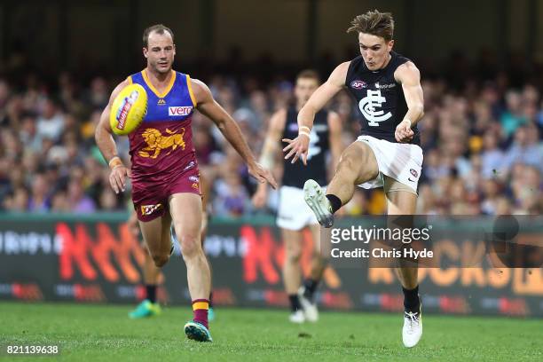 Harrison Macreadie of the Blues kicks during the round 18 AFL match between the Brisbane Lions and the Carlton Blues at The Gabba on July 23, 2017 in...