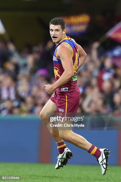 Jake Barrett of the Lions celebrates a goal during the round 18 AFL match between the Brisbane Lions and the Carlton Blues at The Gabba on July 23,...