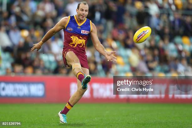 Josh Walker of the Lions kicks during the round 18 AFL match between the Brisbane Lions and the Carlton Blues at The Gabba on July 23, 2017 in...