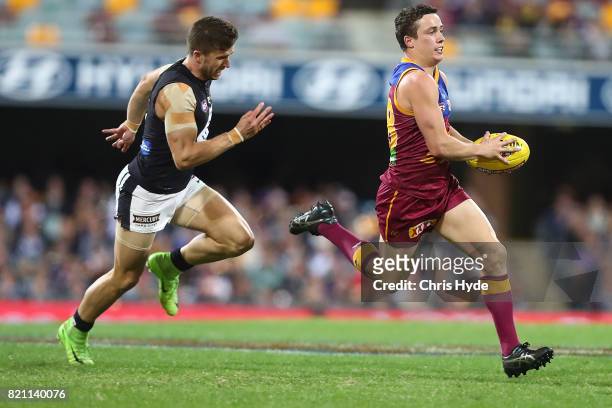 Lewis Taylor of the Lions runs the ball during the round 18 AFL match between the Brisbane Lions and the Carlton Blues at The Gabba on July 23, 2017...