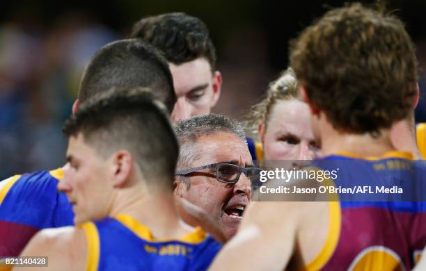 Lions coach Chris Fagan talks to his players during the round 18 AFL match between the Brisbane Lions and the Carlton Blues at The Gabba on July 23,...