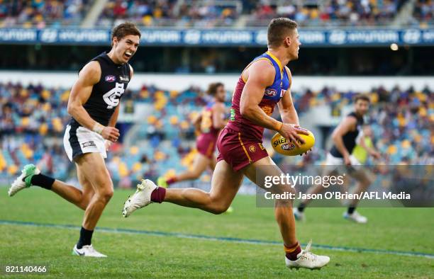 Dayne Zorko of the Lions runs with the ball during the round 18 AFL match between the Brisbane Lions and the Carlton Blues at The Gabba on July 23,...