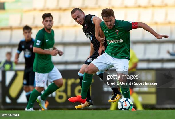 Stanislav Lobotka of Celta de Vigo competes for the ball with Pablo Rey of Racing de Ferrol during the pre-season friendly match between Celta de...