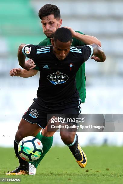 Claudio Beauvue of Celta de Vigo competes for the ball with Fran Sota of Racing de Ferrol during the pre-season friendly match between Celta de Vigo...