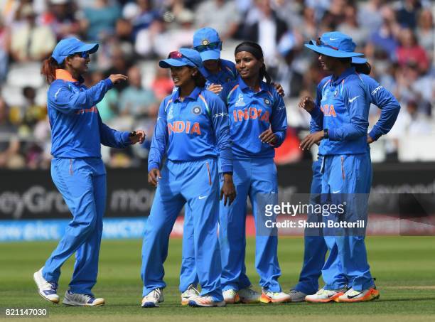 Rajeshwari Gayakwad is congratulated by team-mates after taking a wicket during the ICC Women's World Cup 2017 Final between England and India at...