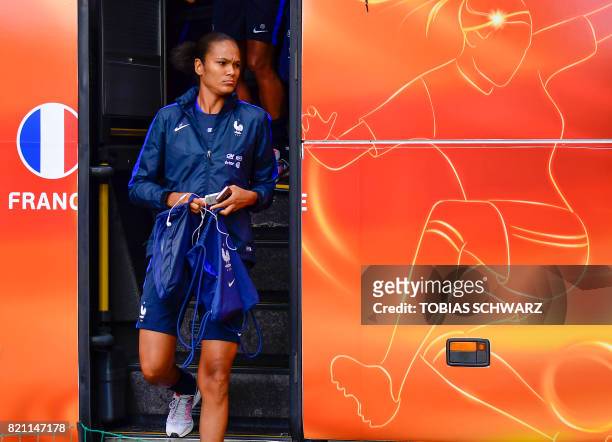Defender Wendie Renard exits the team bus as she arrives for a training session of France's women national soccer team within the UEFA Women's Euro...