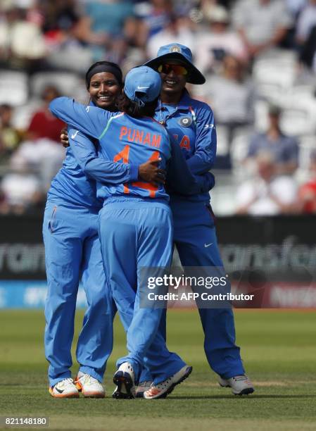 India's Rajeshwari Gayakwad celebrates with teammates after taking the wicket of England's Lauren Winfield during the ICC Women's World Cup cricket...