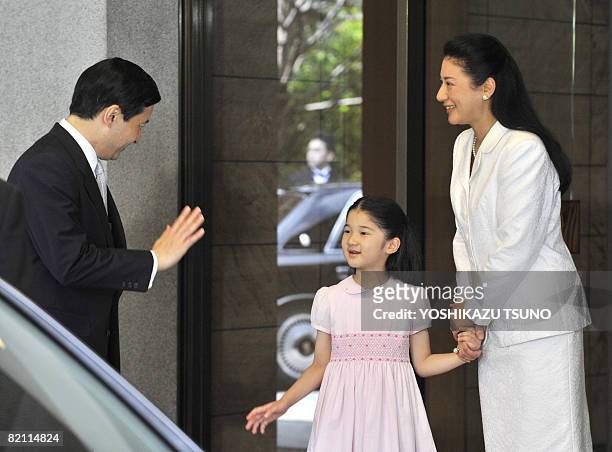 Japanese Princess Aiko and Crown Princess Masako see off Crown Prince Naruhito at the entrance of the Togu Palace in Tokyo on July 30, 2008. Naruhito...