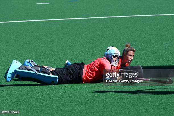 Belen Succi, Goalkeeper of Argentina and Susannah Townsend of England look at the ball go into the goal during day 9 of the FIH Hockey World League...