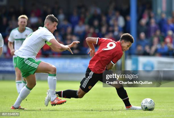 Nishan Burkart of Manchester United and Eoin Toal of Northern Ireland during the NI Super Cup game between Manchester United u18s and Northern...