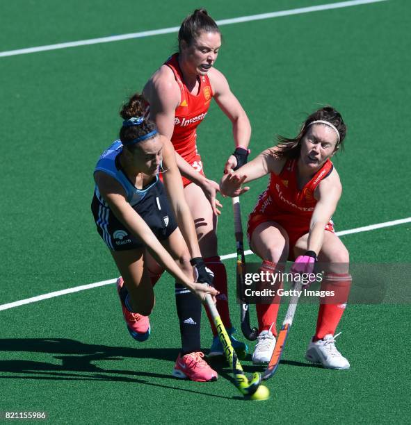 Grace Balsdon and Laura Unsworth of England tackle Eugenia Trinchinetti of Argentina during day 9 of the FIH Hockey World League Women's Semi Finals...