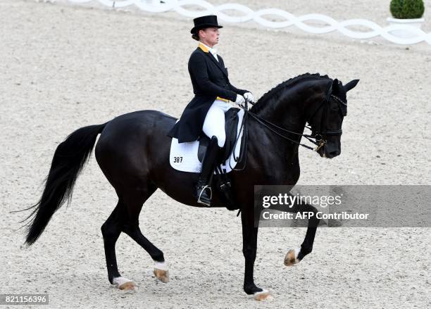 German rider Isabell Werth on her horse Weihegold OLD competes in the Grand Prix Freestyle CDIO during the World Equestrian Festival CHIO in Aachen...